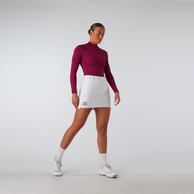 Sustainable womens boysenberry golf compression top